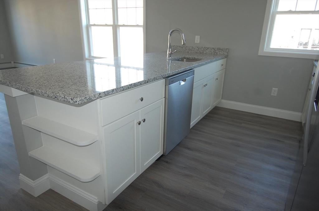 9 Bolton Road, Unit S Dartmouth, MA 02748 - Photo 5 of 19 a kitchen with granite countertop a sink and a window