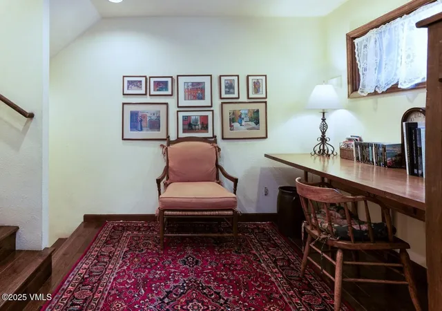 a living room with furniture and a rug