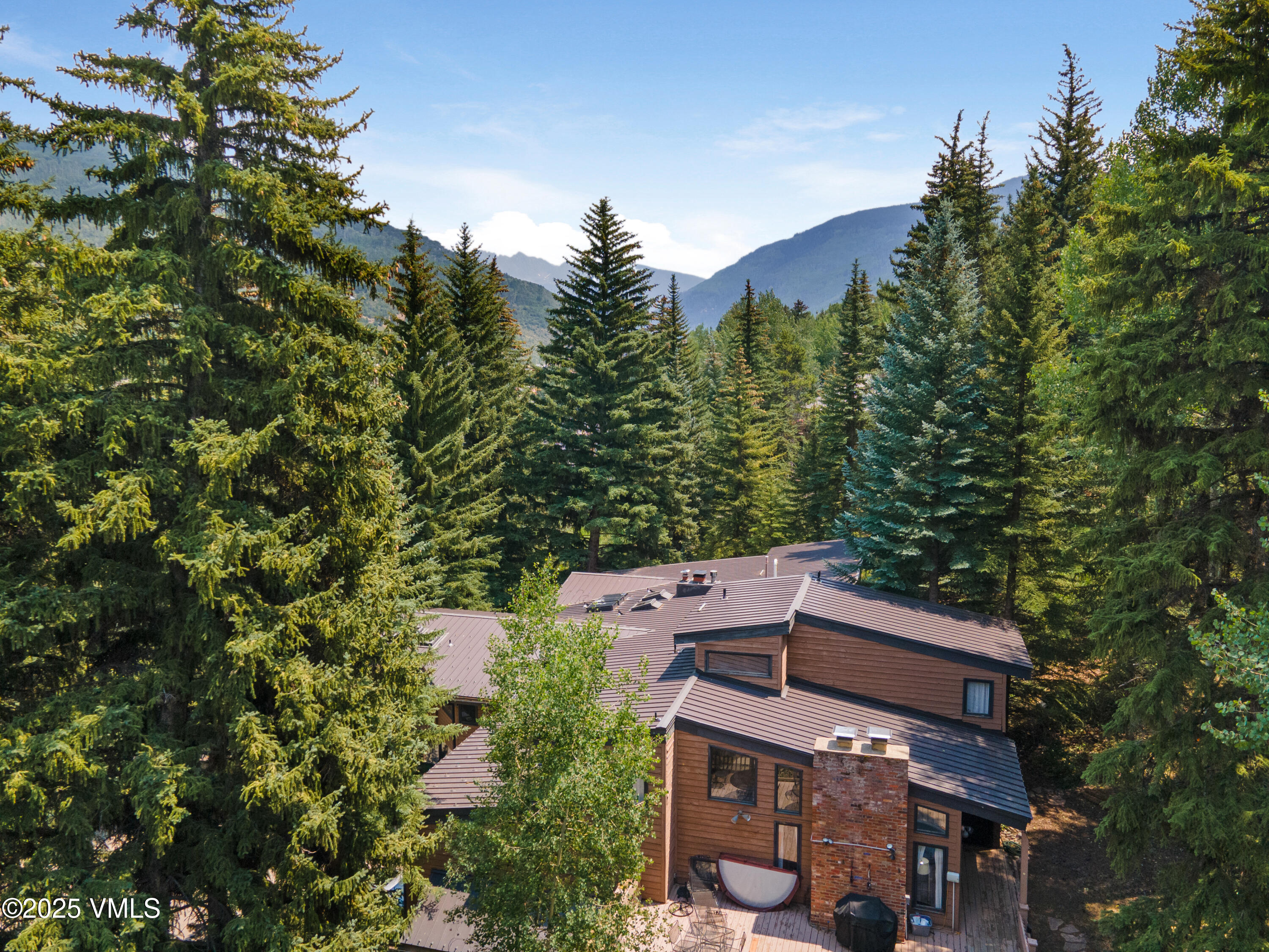 324 Beaver Dam Road, Unit B Vail, CO 81657 - Photo 20 of 22 an aerial view of a house with a yard and mountain view in back