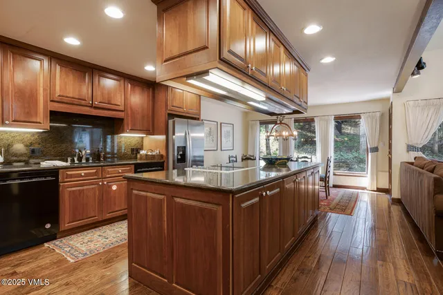 a kitchen with stainless steel appliances granite countertop counter space a sink and cabinets
