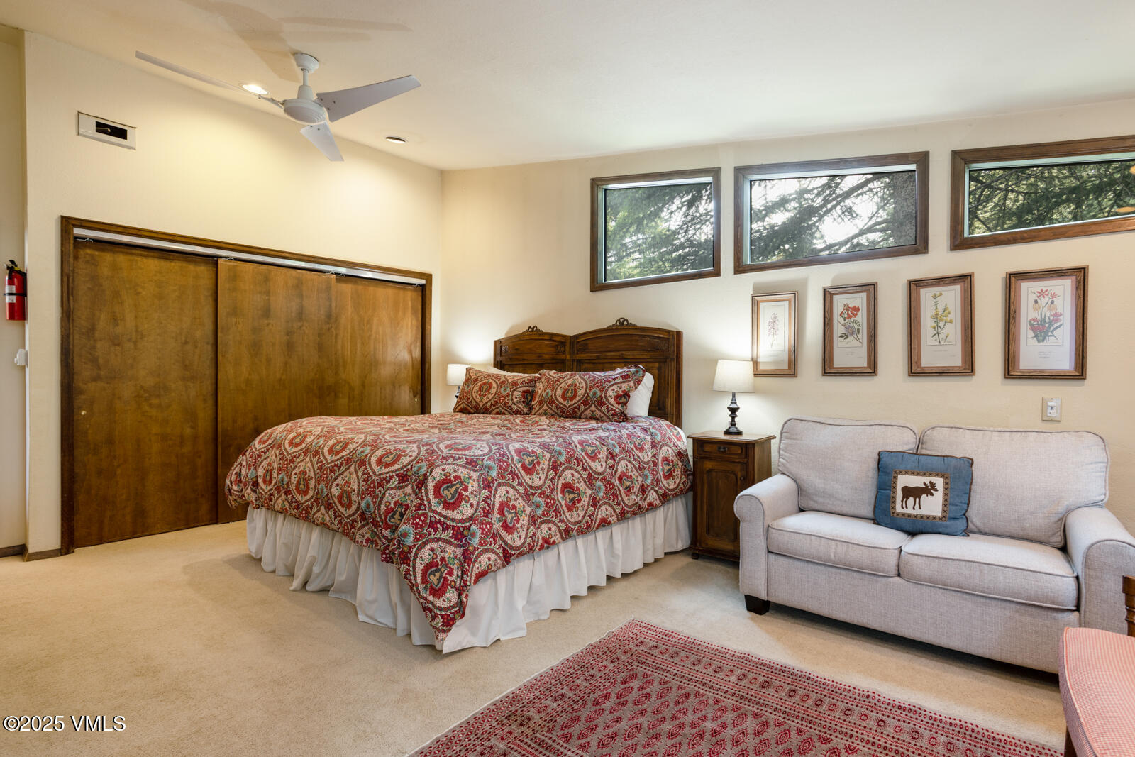 324 Beaver Dam Road, Unit B Vail, CO 81657 - Photo 10 of 22 a spacious bedroom with a bed a couch and a window