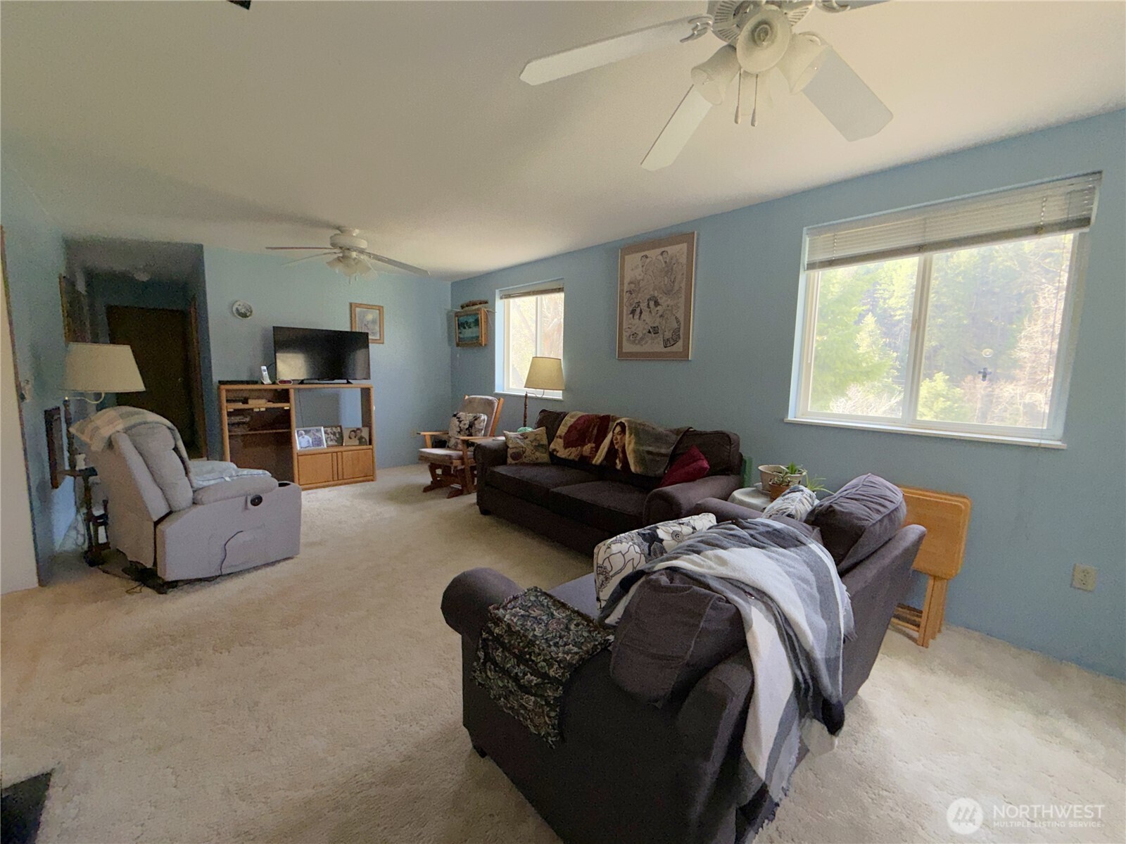 155 St Peters Creek Road Malo, WA 99150 - Photo 11 of 40 a bed room with bed and a couch