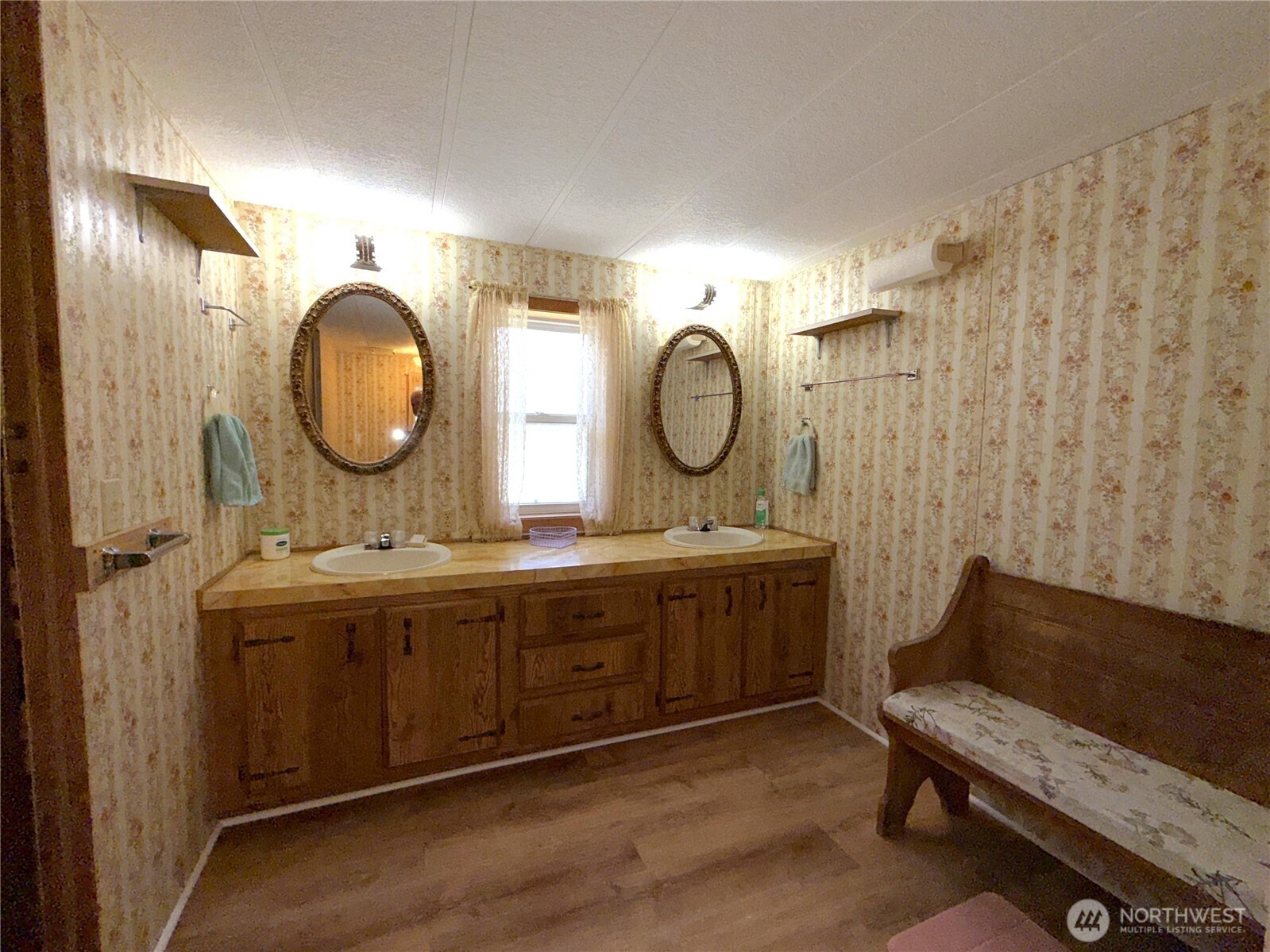 155 St Peters Creek Road Malo, WA 99150 - Photo 15 of 40 a bathroom with double vanity sink and a mirror