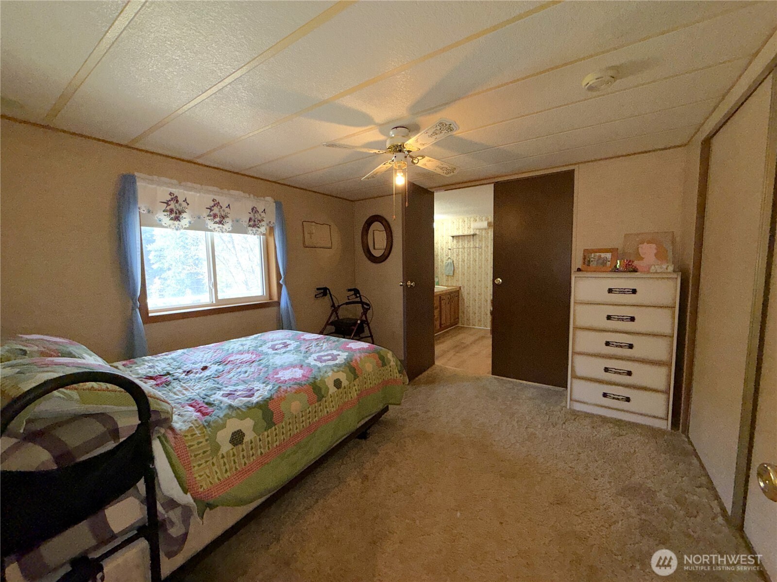155 St Peters Creek Road Malo, WA 99150 - Photo 16 of 40 a bedroom with a bed and a dresser