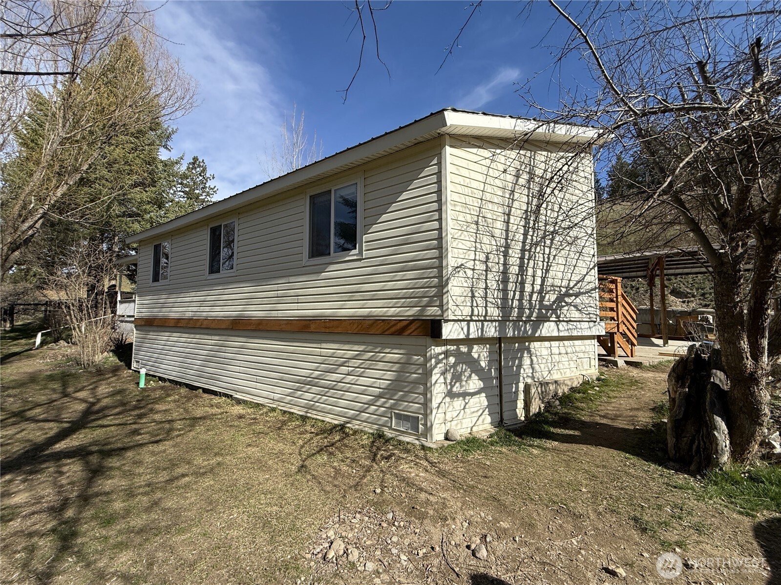 155 St Peters Creek Road Malo, WA 99150 - Photo 22 of 40 a side view of a house with a yard