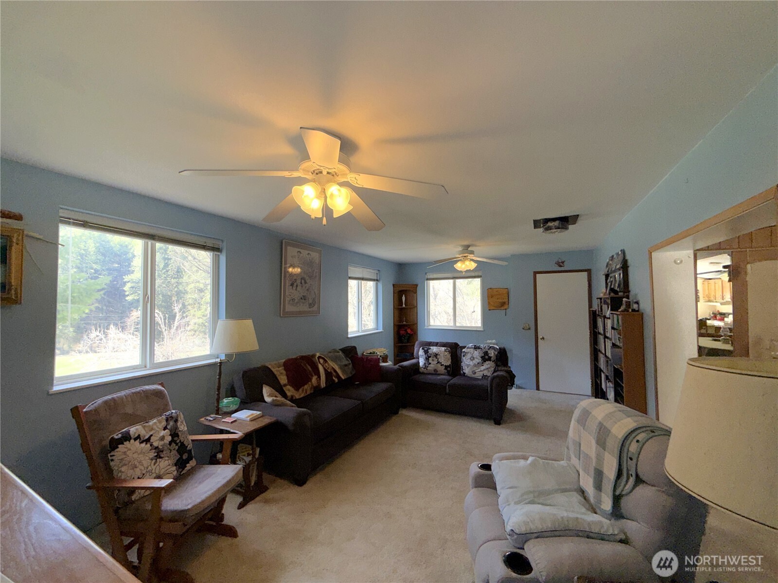 155 St Peters Creek Road Malo, WA 99150 - Photo 9 of 40 a living room with furniture and a large window