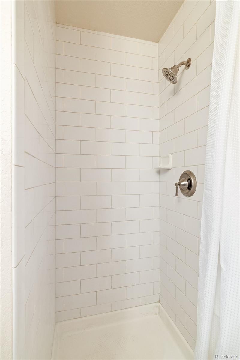 4035 South Dillon Way, Unit 204 Aurora, CO 80014 - Photo 19 of 24 a bathroom with a shower
