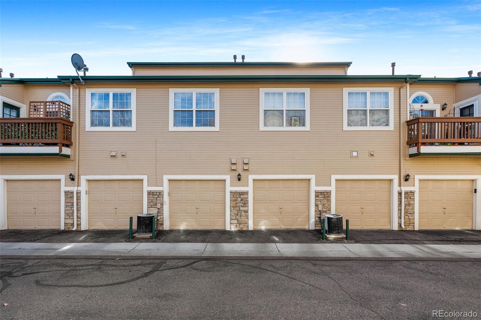 4035 South Dillon Way, Unit 204 Aurora, CO 80014 - Photo 21 of 24 a front view of a house with a road