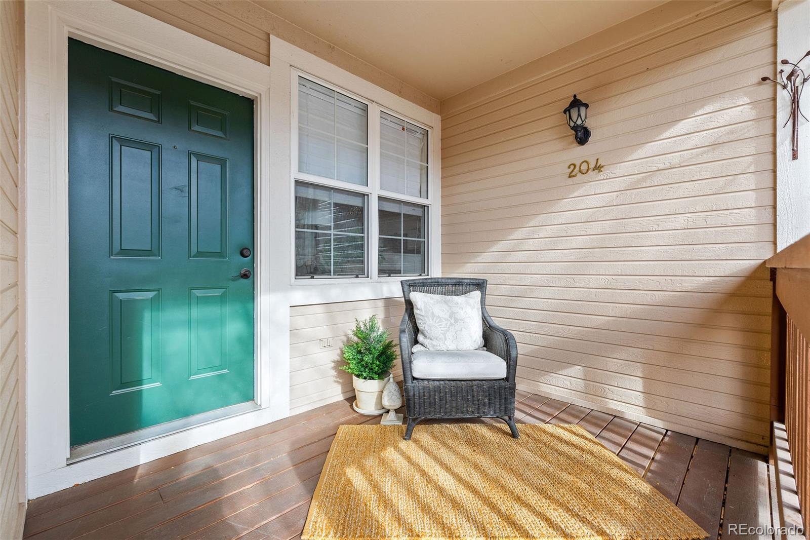 4035 South Dillon Way, Unit 204 Aurora, CO 80014 - Photo 4 of 24 a view of a two chairs in the balcony