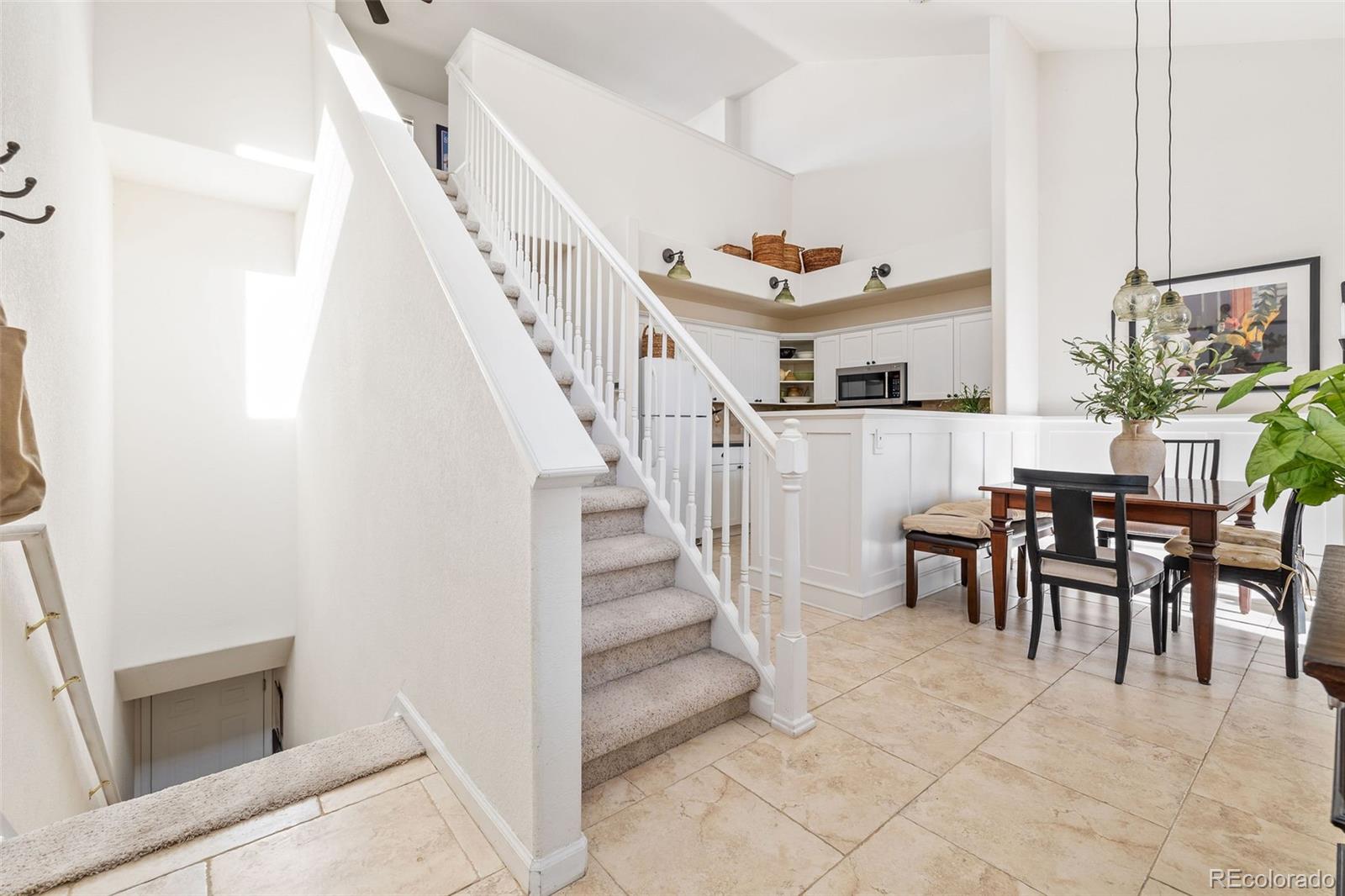 4035 South Dillon Way, Unit 204 Aurora, CO 80014 - Photo 6 of 24 a view of a livingroom with furniture and stairs