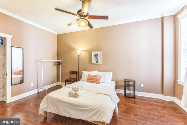 a bedroom with a bed and a table