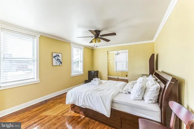 a bedroom with bed and window