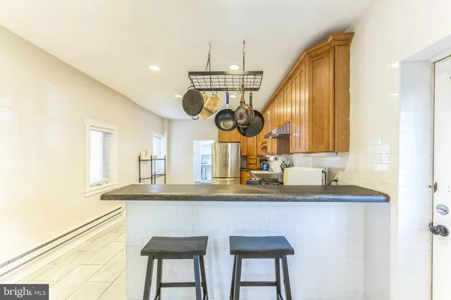 a kitchen with a sink and a refrigerator