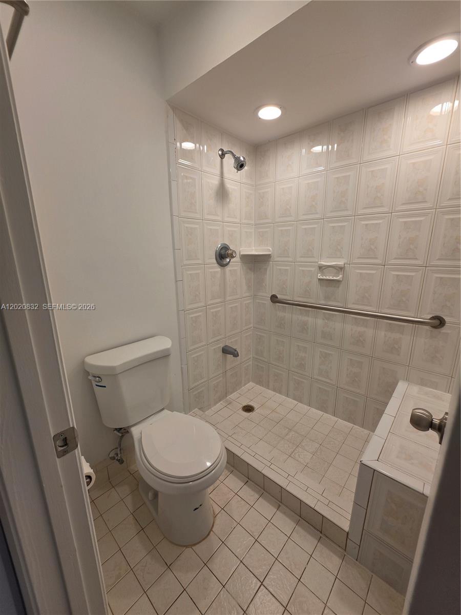 15240 Southwest 45th Terrace, Unit 54F Miami, FL 33185 - Photo 32 of 48 a bathroom with a toilet and a shower