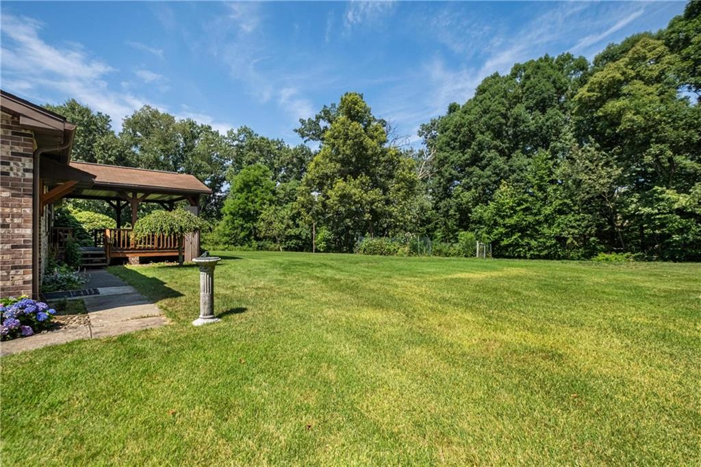 285 Rochester Road Freedom, PA 15042 - Photo 8 of 46 a view of a garden with a bench in a garden