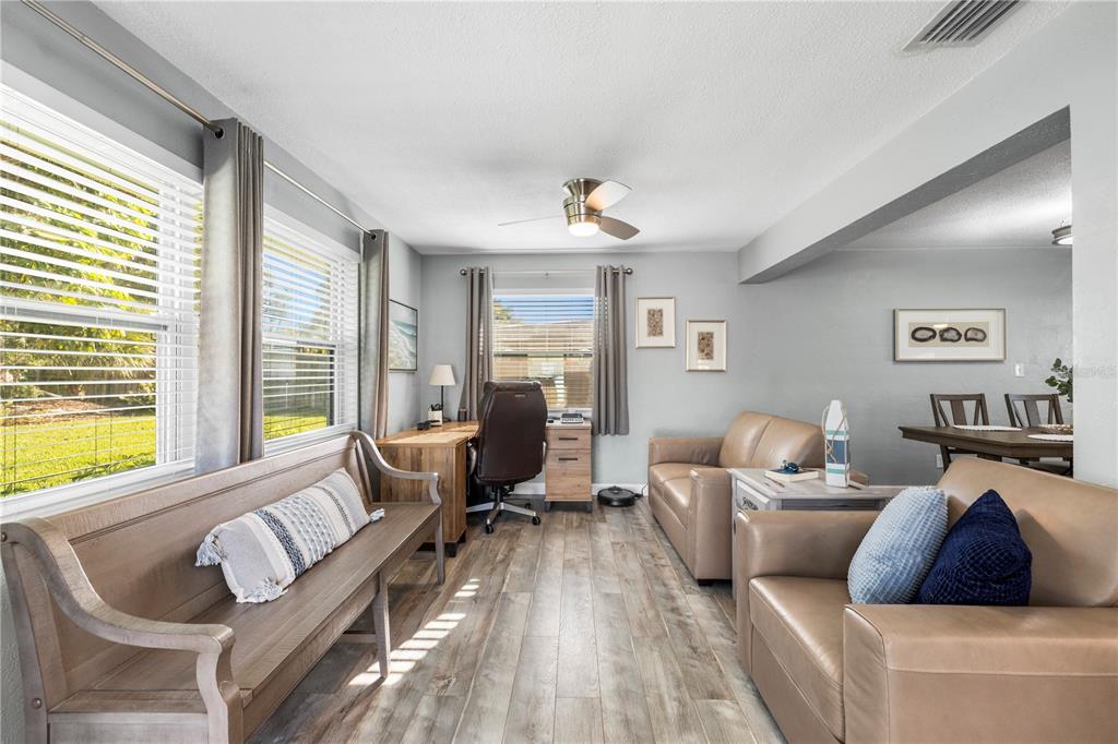 11781 68th Avenue Seminole, FL 33772 - Photo 11 of 60 a living room with furniture and a large window
