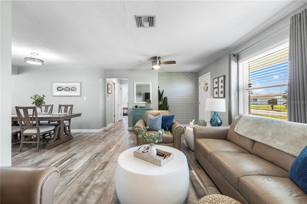 11781 68th Avenue Seminole, FL 33772 - Photo 2 of 60 a living room with furniture and a large window