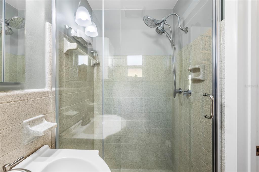 11781 68th Avenue Seminole, FL 33772 - Photo 22 of 60 a bathroom with a shower and toilet