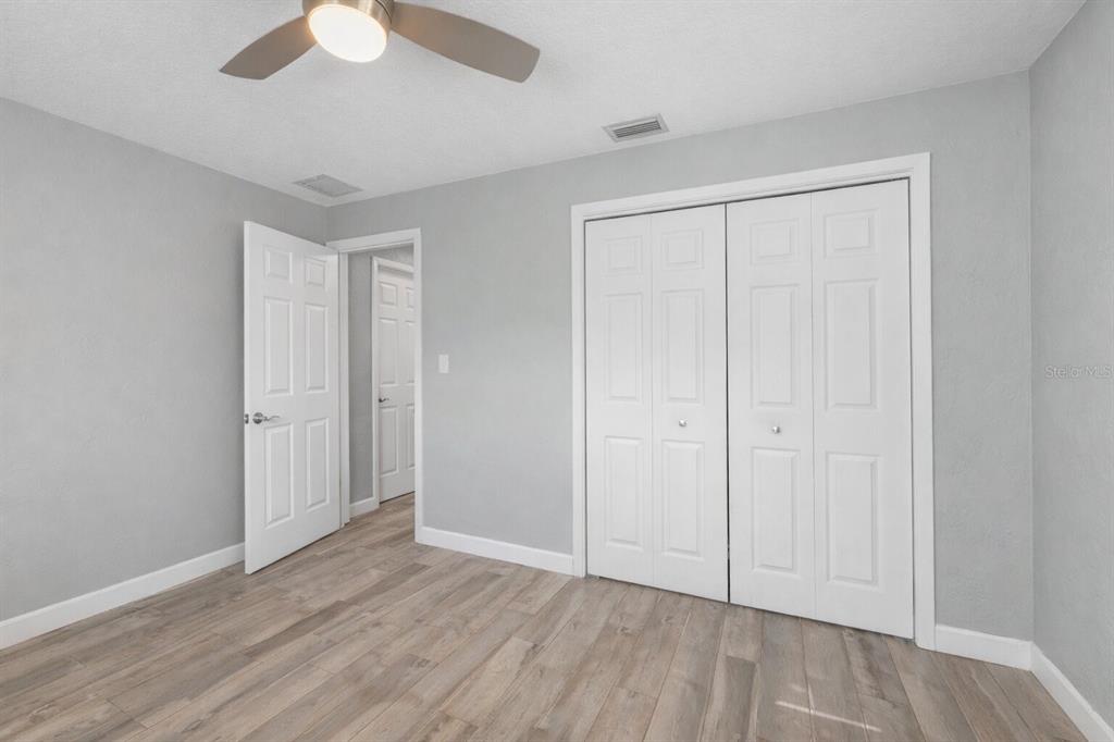 11781 68th Avenue Seminole, FL 33772 - Photo 25 of 60 a view of an empty room and wooden floor