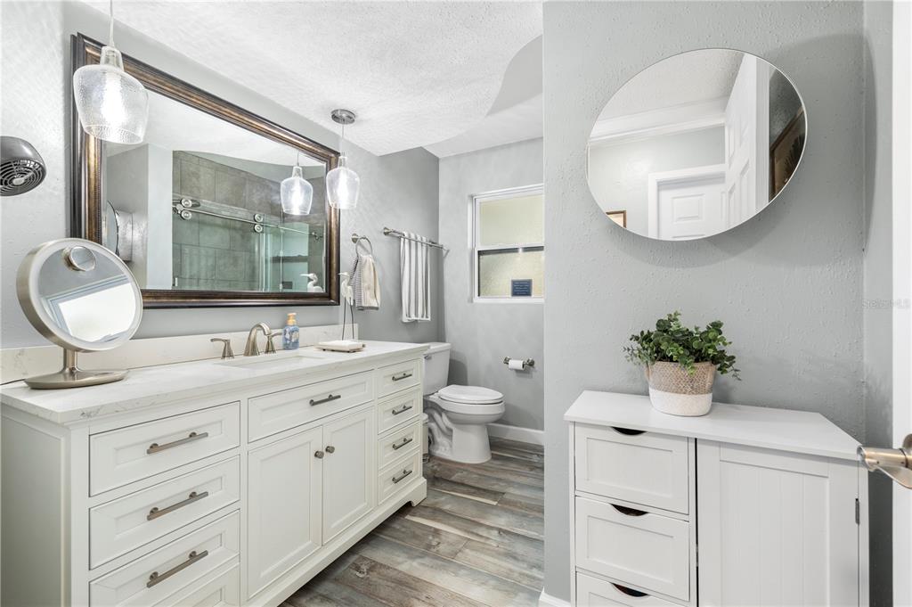 11781 68th Avenue Seminole, FL 33772 - Photo 26 of 60 a bathroom with a toilet sink and mirror