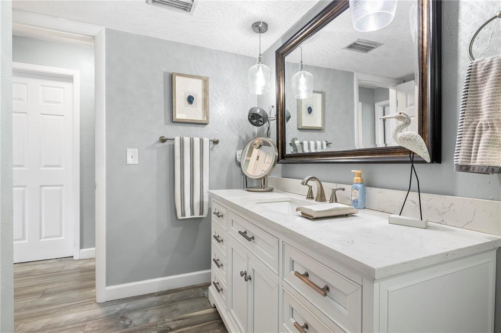 11781 68th Avenue Seminole, FL 33772 - Photo 27 of 60 a bathroom with a sink and a mirror
