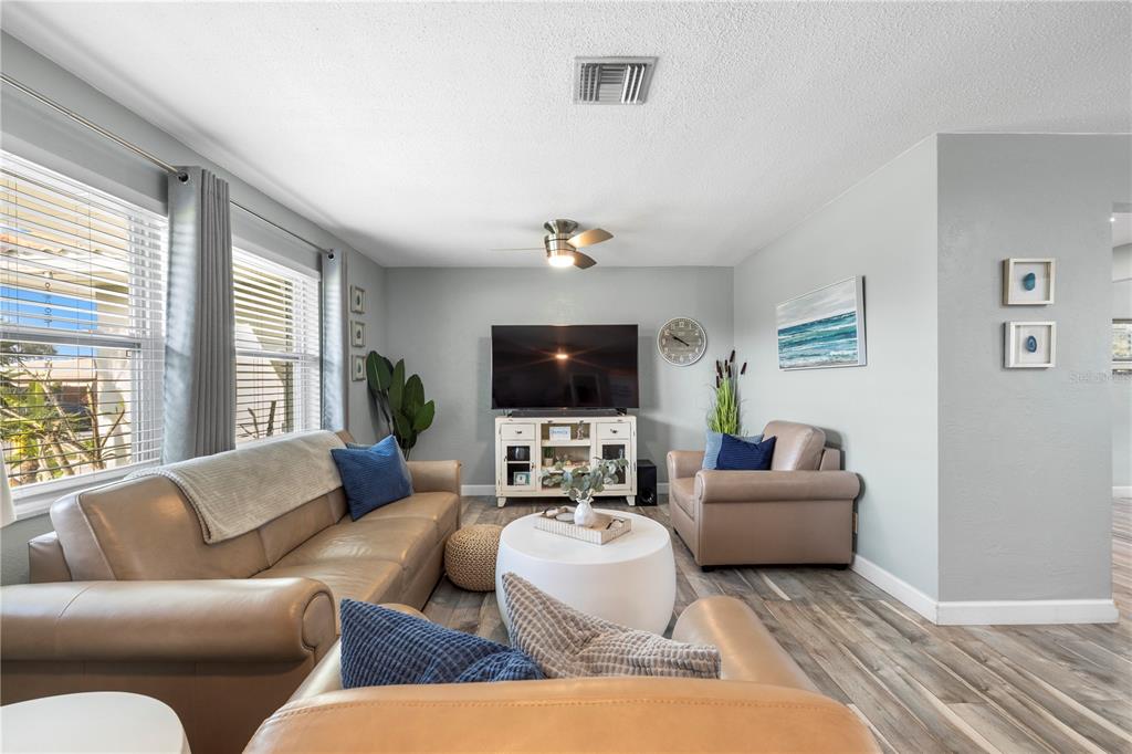 11781 68th Avenue Seminole, FL 33772 - Photo 3 of 60 a living room with furniture and a flat screen tv