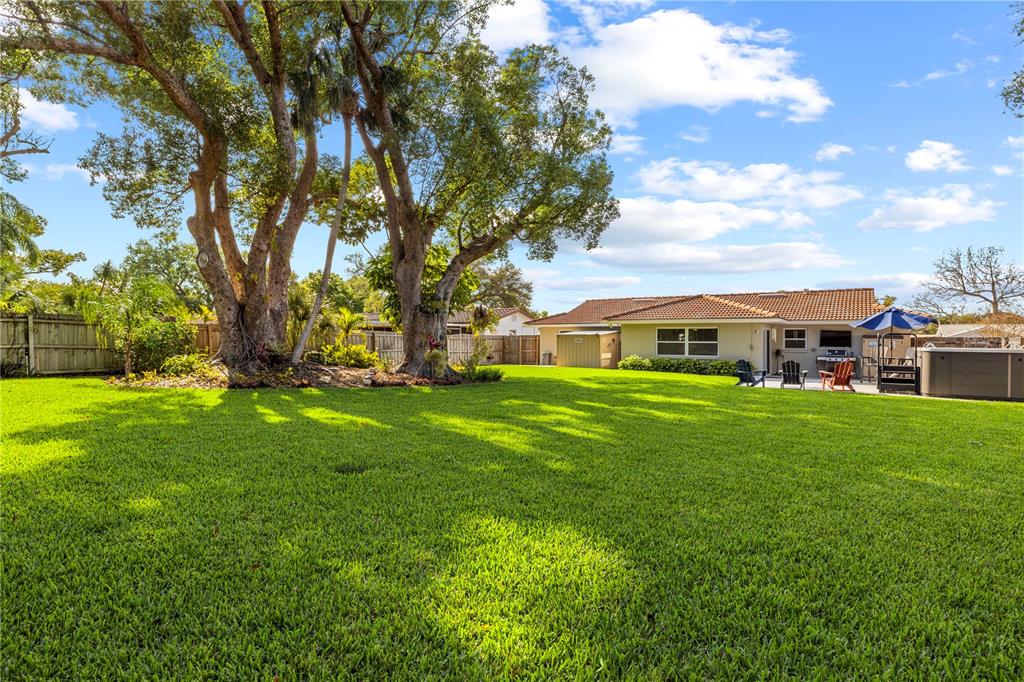 11781 68th Avenue Seminole, FL 33772 - Photo 36 of 60 a front view of house with yard and trees