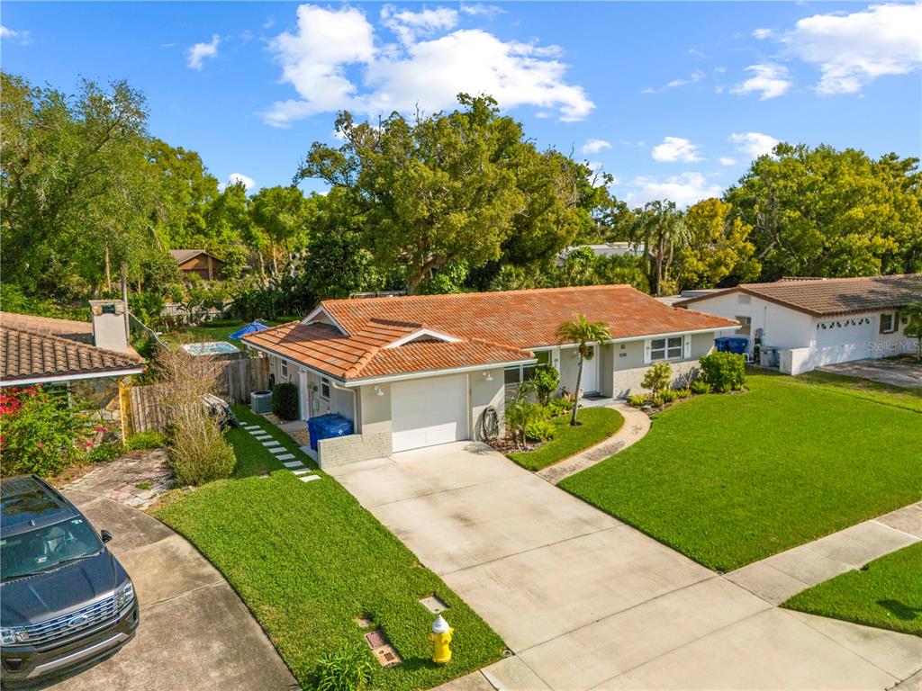 11781 68th Avenue Seminole, FL 33772 - Photo 44 of 60 a front view of a house with a garden