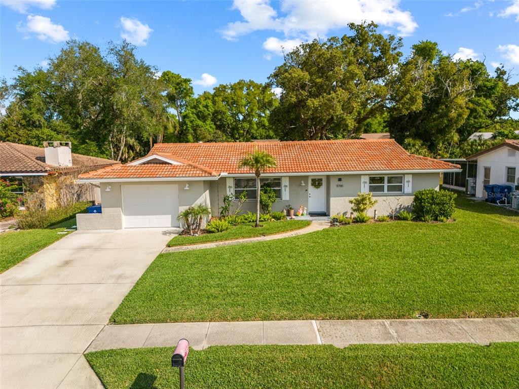 11781 68th Avenue Seminole, FL 33772 - Photo 46 of 60 a front view of a house with a yard