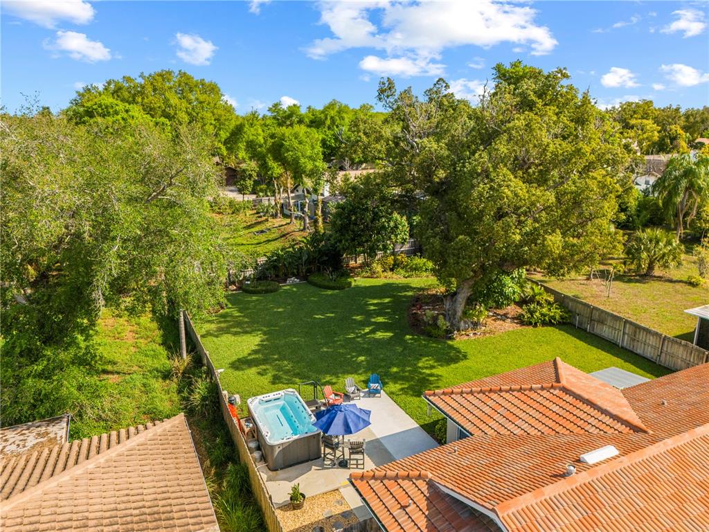 11781 68th Avenue Seminole, FL 33772 - Photo 49 of 60 a view of swimming pool outdoor seating and trees