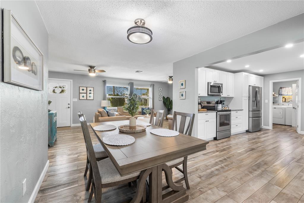 11781 68th Avenue Seminole, FL 33772 - Photo 5 of 60 a view of a dining room with furniture and wooden floor