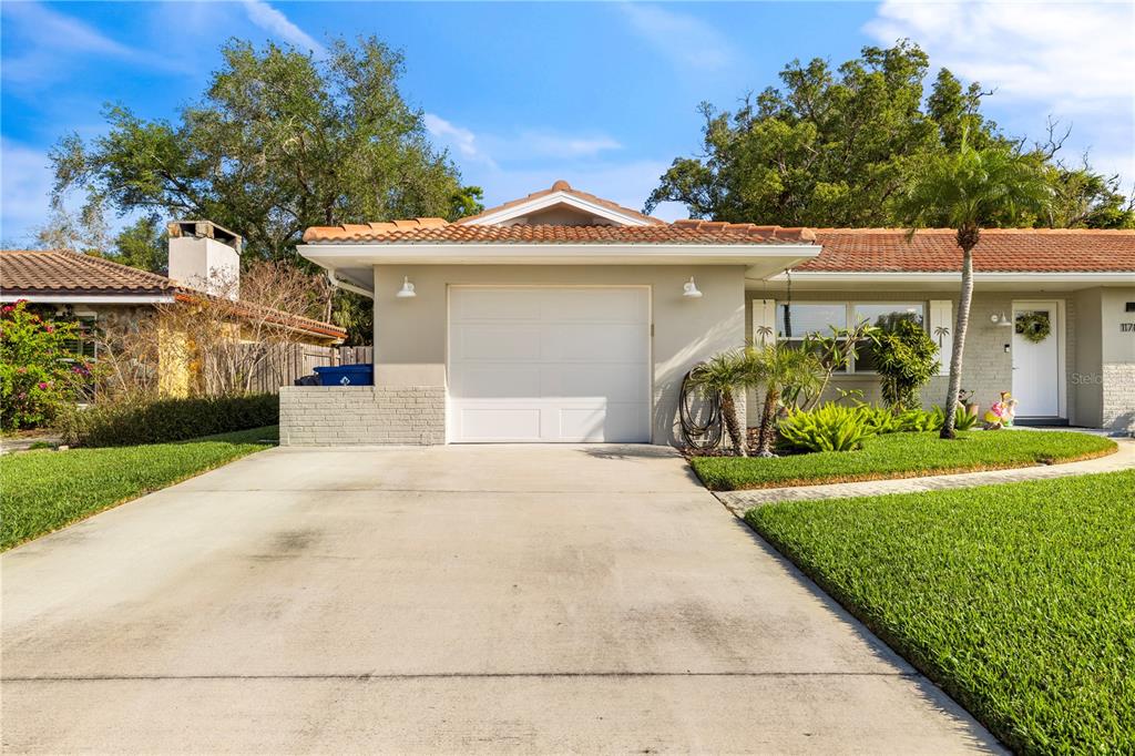 11781 68th Avenue Seminole, FL 33772 - Photo 60 of 60 a front view of a house with garden