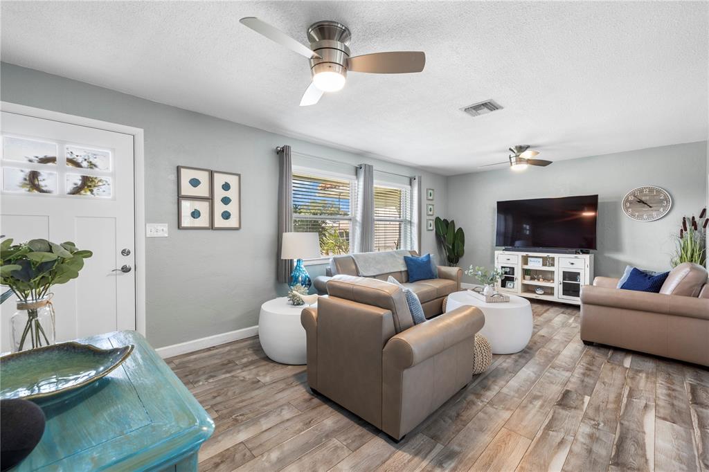11781 68th Avenue Seminole, FL 33772 - Photo 6 of 60 a living room with furniture and a flat screen tv