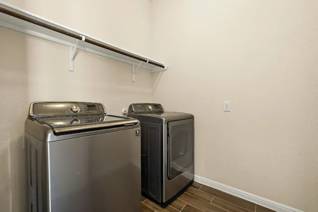 a utility room with dryer and washer