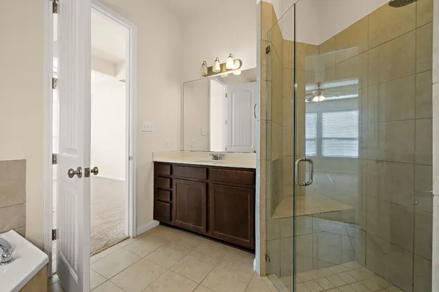 a bathroom with a shower and a sink