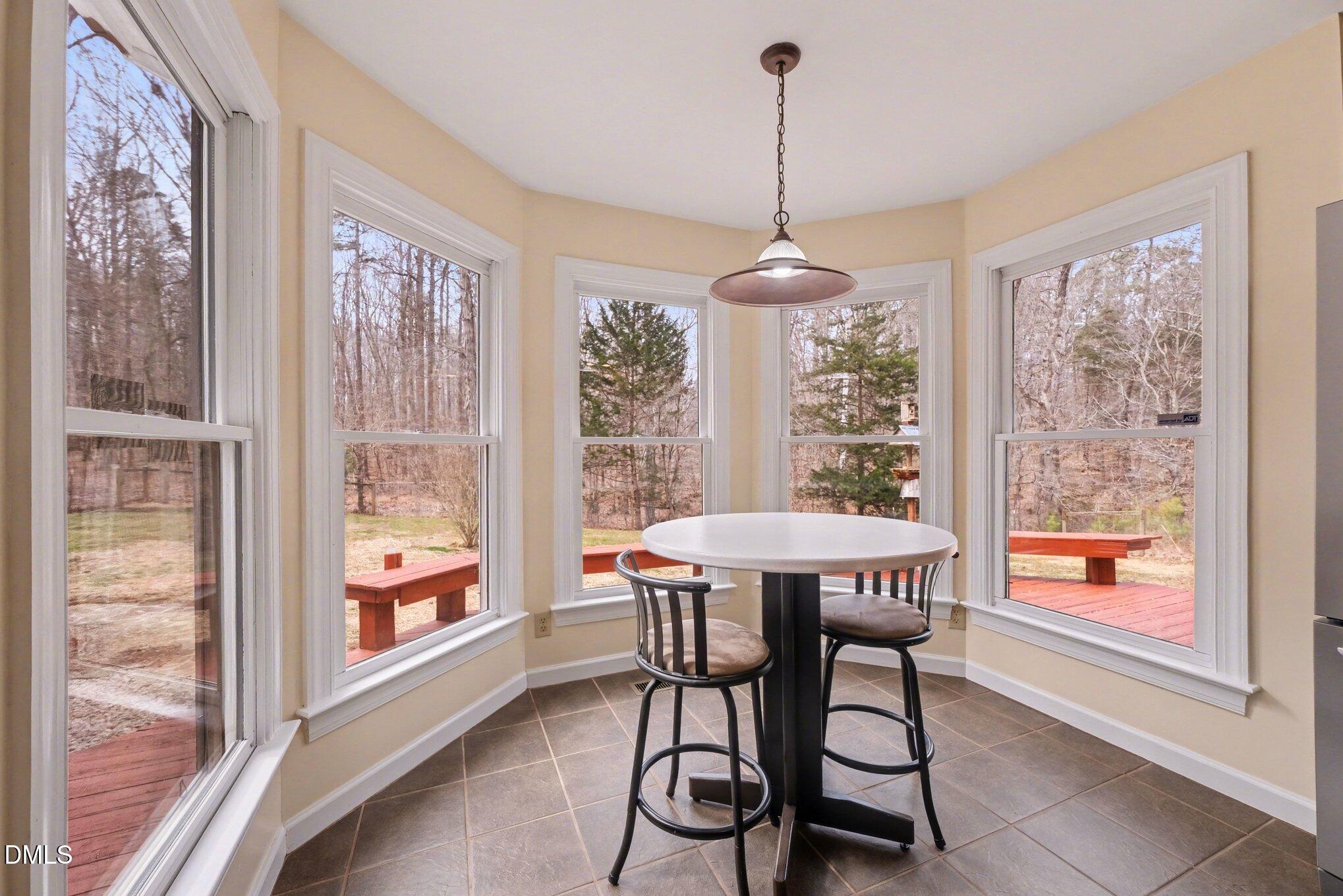 2404 Bane Road Efland, NC 27243 - Photo 16 of 46 a dining room that has a chandelier and a table in it