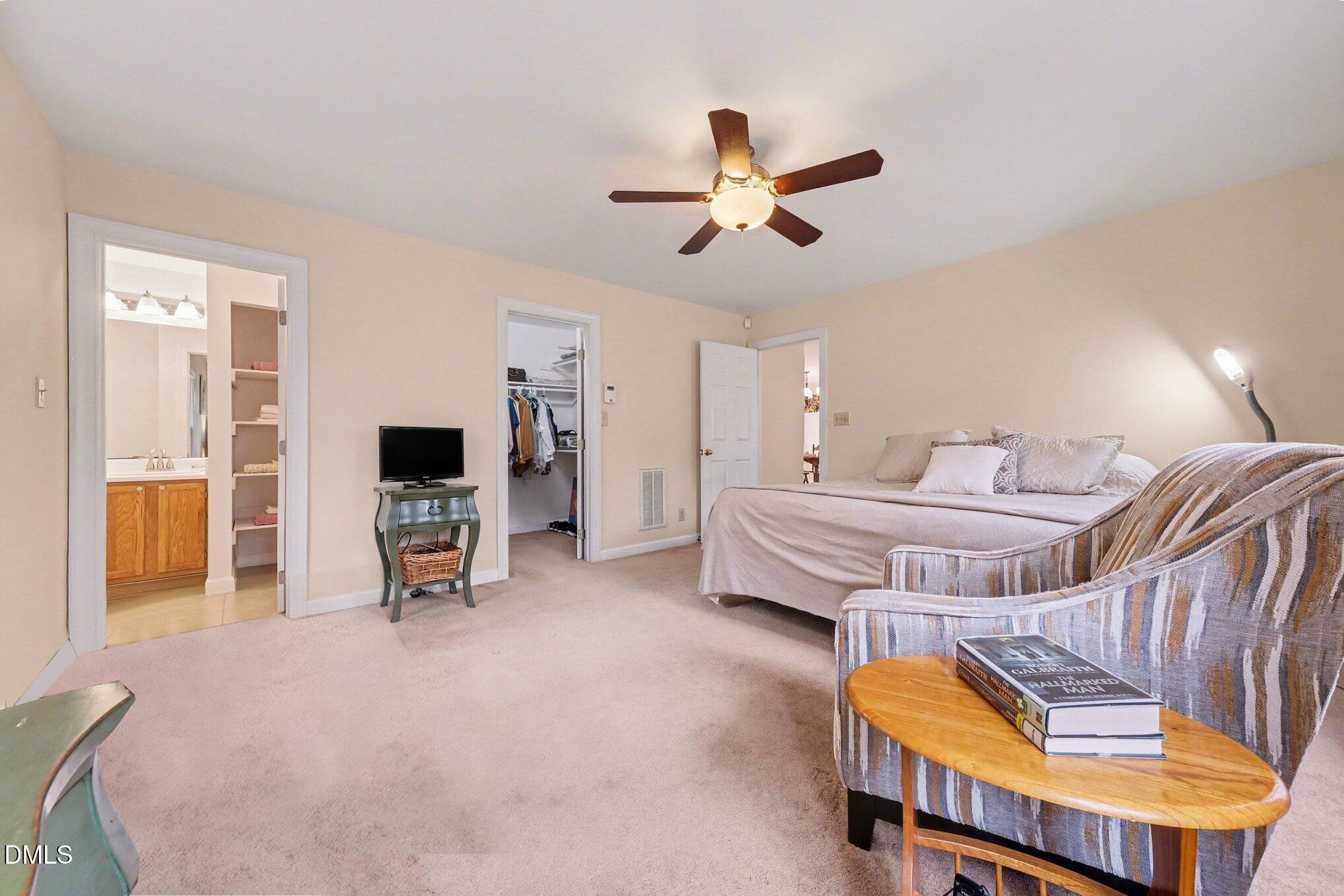 2404 Bane Road Efland, NC 27243 - Photo 23 of 46 a bedroom with furniture and a chair