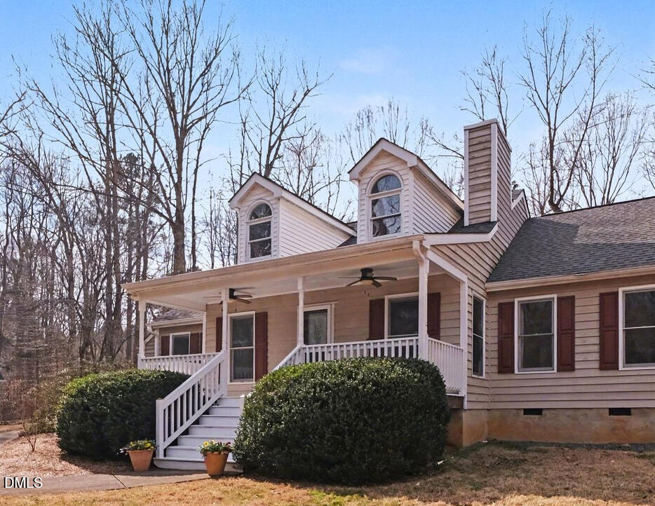 2404 Bane Road Efland, NC 27243 - Photo 30 of 46 a front view of a house with a garden