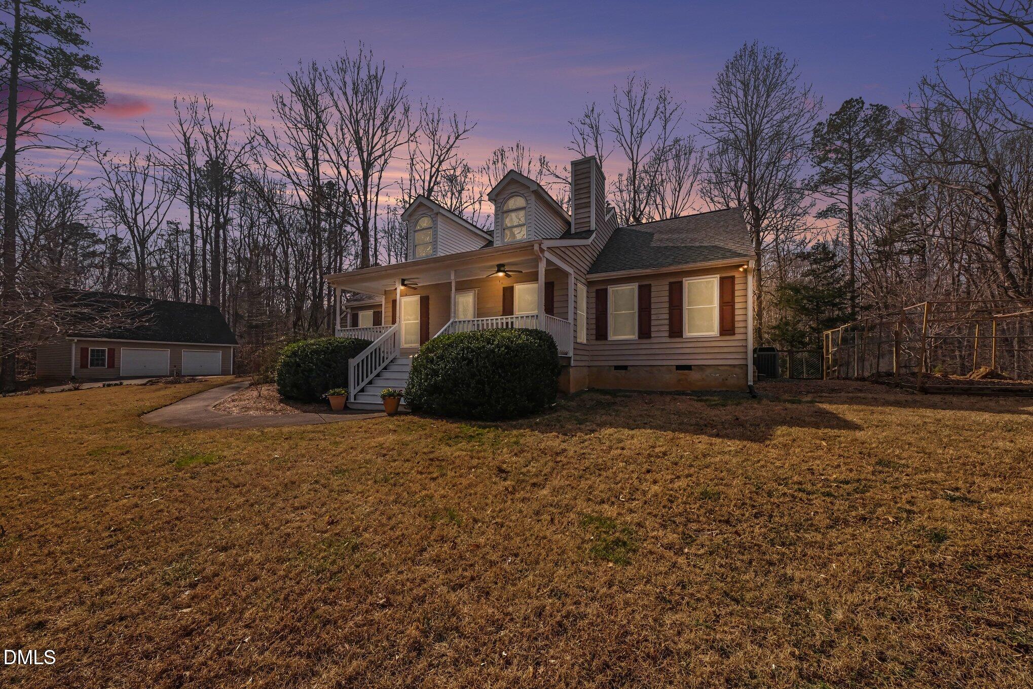 2404 Bane Road Efland, NC 27243 - Photo 42 of 46 a front view of a house with a yard