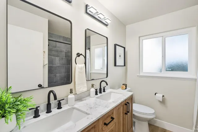 a view of a white house with a bath tub