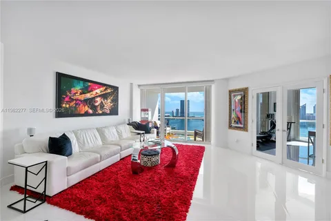 a living room with furniture and a rug