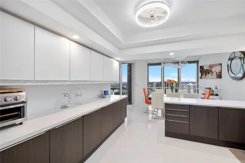 a room with patio furniture and a large window