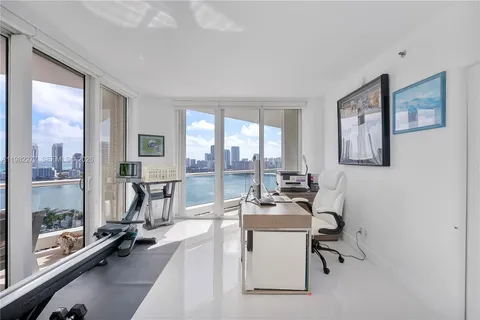 a living room with furniture fireplace and a flat screen tv