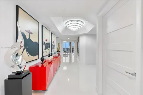 a bedroom with a bed and a night stand