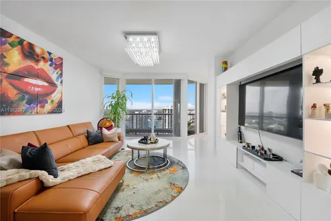 an aerial view of a house with a lake view