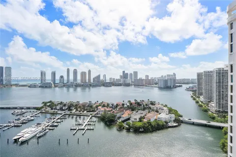 a view of swimming pool with outdoor seating and city view