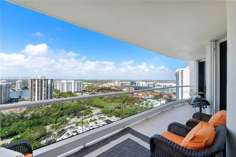 a lobby with furniture and potted plant