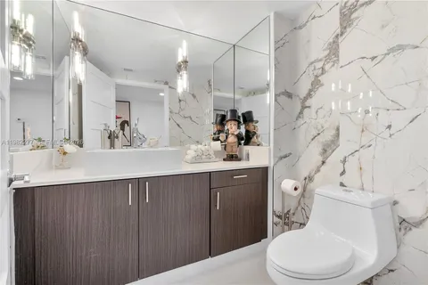 a dining room with kitchen island a table and chairs