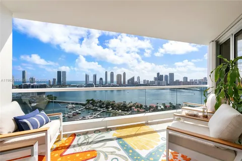 a view of swimming pool with outdoor seating and plants