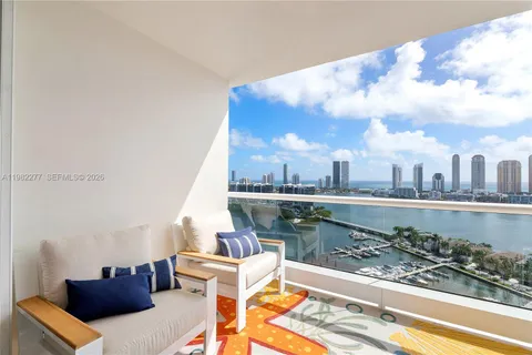 a living room with furniture a flat screen tv and gym equipment